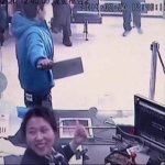 Bank teller laughs at robber with meat cleaver