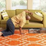 Man Looking For Money In The Couch