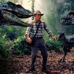 Jurassic guy surrounded by dinosaurs
