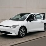 A new ELECTRIC VEHICLE parked with steering wheel on the right,