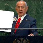 Netanyahu Holds Up Sign