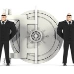 Two guards in front of safe