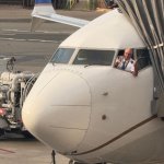 Pilot hanging out the window
