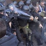 Cop Pepper Spray Themselves