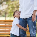 Little Boy looking up at Daddy