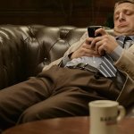 On phone on couch