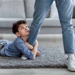 Little Boy looking up at Daddy Perry PhD Cypress JPP