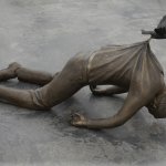 Statue of Man pulled by Bird