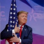 Used car salesman hugs flag
