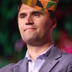 Charlie Kirk with african hat