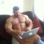 Buff dude using laptop