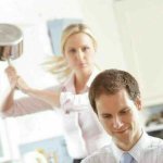 Woman hitting man with sauce pan