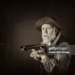 Old man with gun