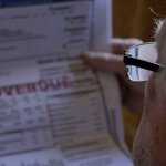Old White Man MAGA looking at overdue bills Trump