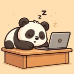 sleeping panda bear on desk with laptop
