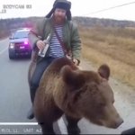 Man riding bear