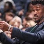 man looking at paper template