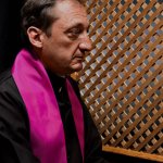 Priest confessing listening