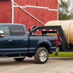 Truck Towing A Trailer With Hay Bales In It meme
