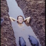 Patrick Blanc laying in a ditch