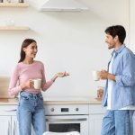 Couple talking in kitchen