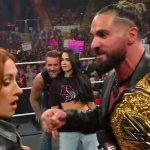 Punk and AJ watching Seth and Becky fight