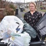 overfilled trash bin frustrated woman