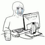 A persons iting in front of computer