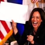Kamala holds up blank sign meme