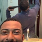 Guy in front of mirror with gun
