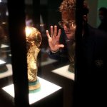 Neymar Looking at World Cup Trophy