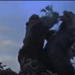 King Kong shoving tree in Godzilla's mouth meme