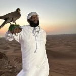 Rick Ross holding an eagle