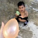 Baby crying water balloon fight