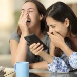 Girls laughing at phone