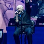 Phil Collins sitting