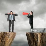 businessman shouting at another