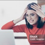 upset woman staring at computer