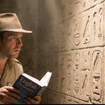 Man reading hieroglyphics