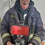 firefighter with coffee maker