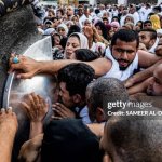 Muslims kiss the wall