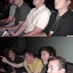 Guys cheering on couch