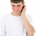 white tee guy blushing