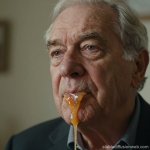 elderly old man orange goo lips and chin