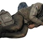 Hobo with two backpacks on floor