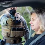 ICE agent threatening to shoot old woman