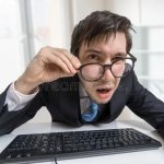 Guy Staring at screen confused