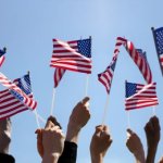 Americans waving American flags
