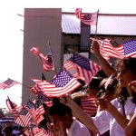 Americans waving American flags