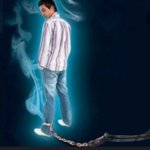 Man looking back with ball and chain